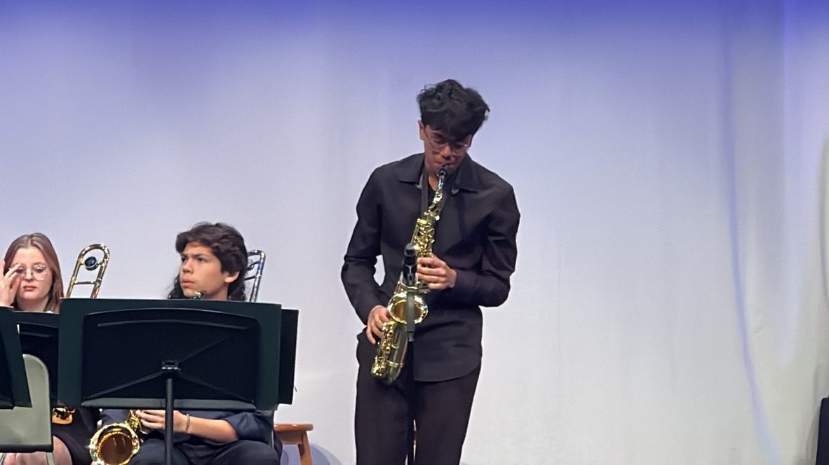 Aditya playing alto saxophone with the Trinity Jazz Ensemble.